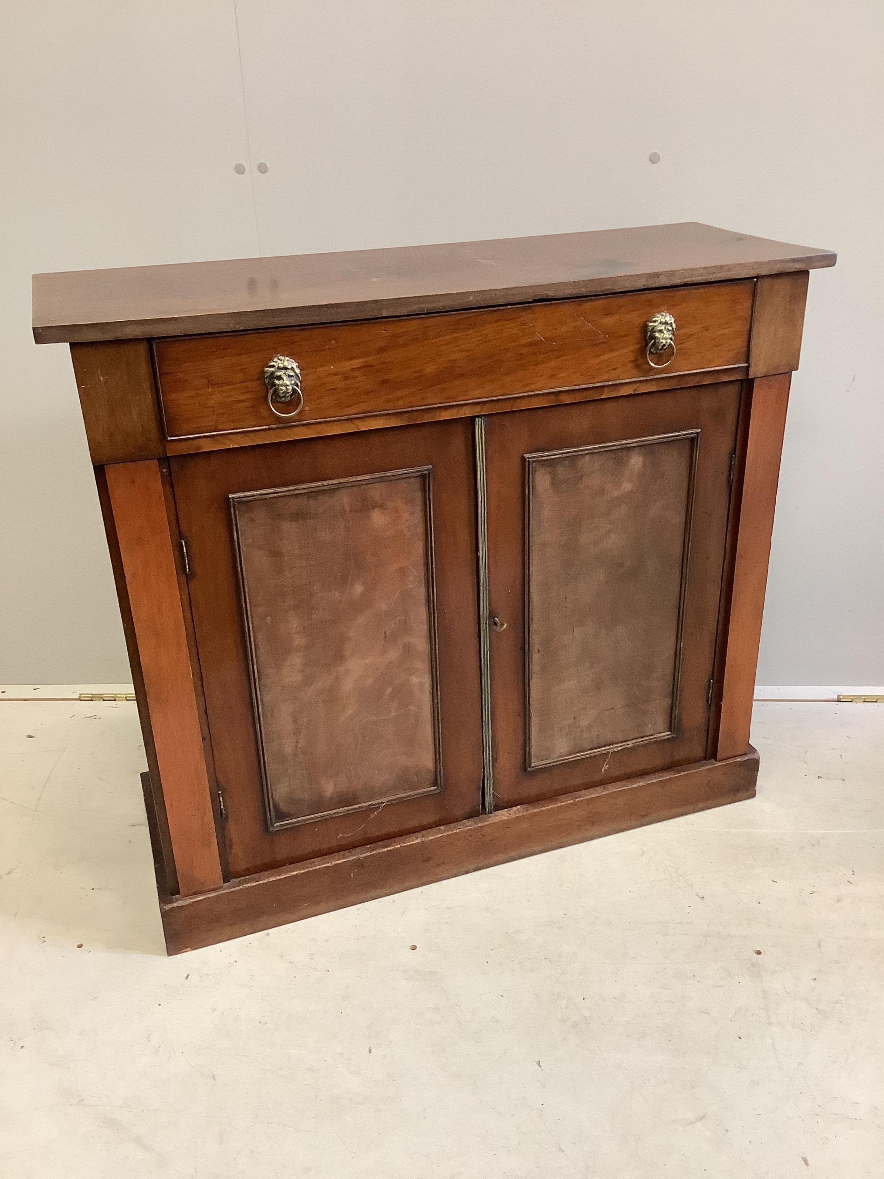 A Regency style mahogany side cabinet, fitted one long drawer over panelled cupboard, width 91cm, depth 32cm, height 80cm. Condition - poor